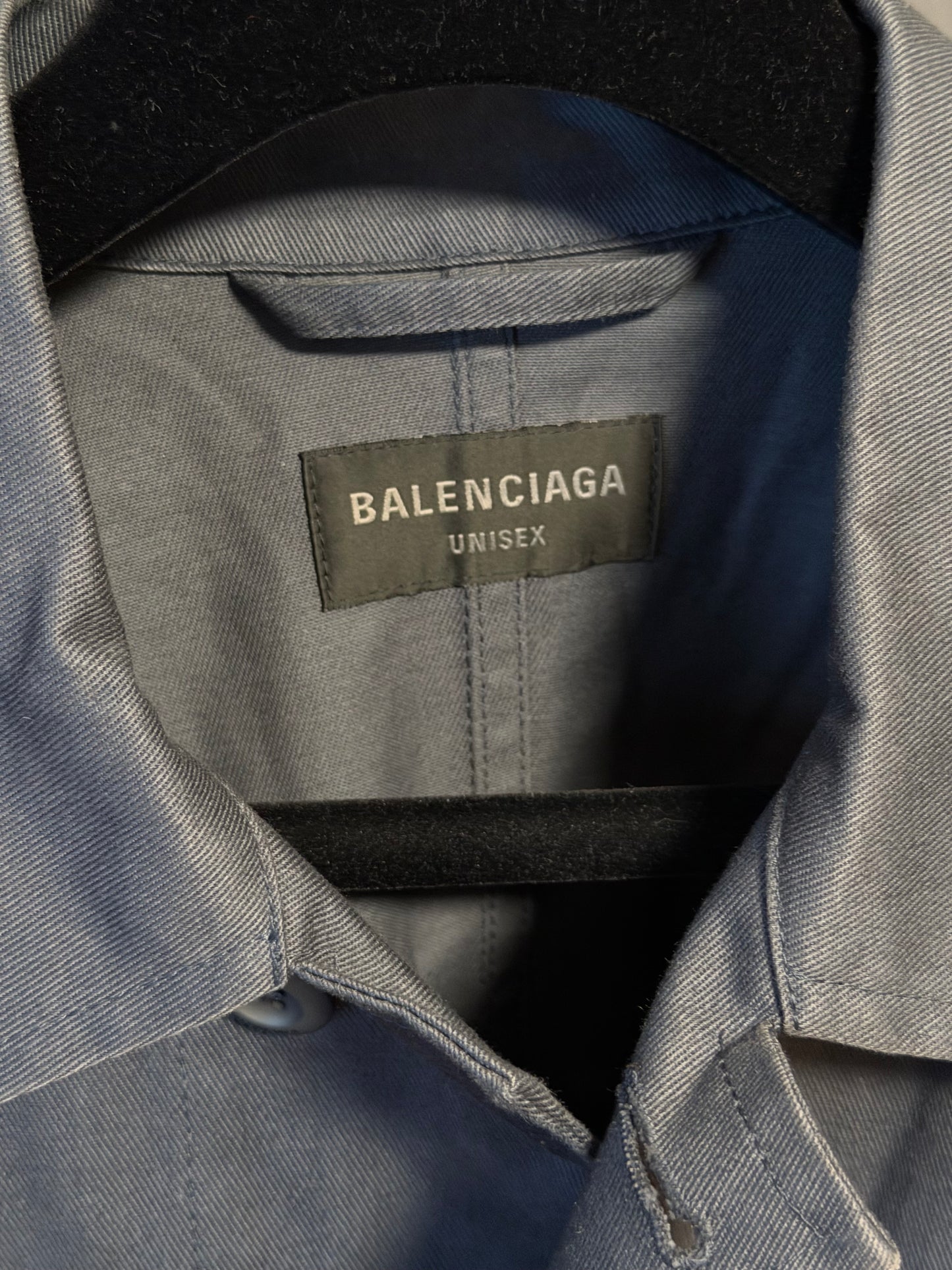 Close-up of a Balenciaga label on a gray garment